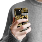 kennesaw-state-owls-flamingo-palm-trees-gold-phone-case-best-selling.webp