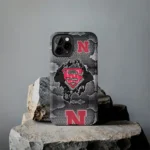 nebraska-cornhuskers-superman-emblem-burst-gray-phone-case-best-selling.webp