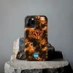 personalized-oklahoma-state-cowboys-camo-abstract-orange-phone-case-best-selling.webp